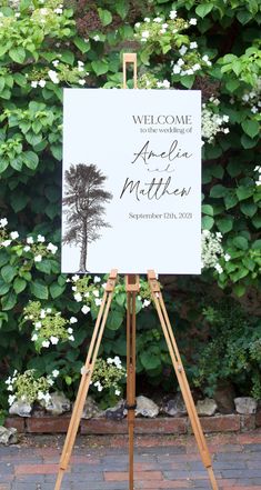 an easel with a welcome sign on it