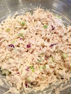 a bowl filled with chicken salad on top of a table