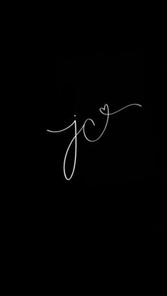 the word joy written in cursive writing on a black background with white ink