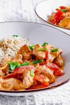 a white plate topped with chicken and rice