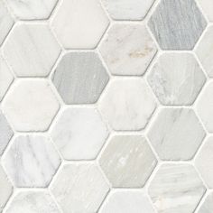 white and grey hexagon marble tile with gray grouting in the middle