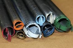 several different colored hoses are lined up on the table together and ready to be used