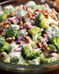 broccoli salad with dressing and nuts in a glass bowl