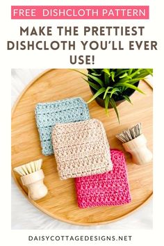 three crocheted dishcloths sitting on top of a wooden table next to a plant