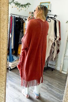 Looking for a stylish and fun way to stay warm this winter? Check out our Open Work Frayed Bohemian Ruana! This cute and cozy wrap is perfect for chilly days and nights, and can be dressed up or down to suit any occasion! #lovemyleto 100% Acrylic Imported Cozy Fringe Outerwear For Fall, Bohemian Shawl For Fall Layering, Cozy Long Sleeve Outerwear With Fringe, Cozy Fall Poncho For Beach, One Size Fringe Sweater For Fall, Oversized Fringe Sweater For Winter, Cozy Fringe Cardigan For Fall, Bohemian Fall Outerwear With Tassels, Bohemian Fringe Outerwear For Fall