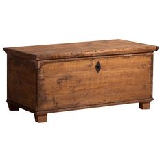 an old wooden chest with two drawers on one side and a door at the top