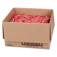 a cardboard box filled with red wrapping paper