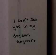 graffiti written on the side of a white wall