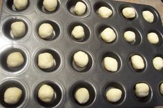 doughnut holes in a pan ready to go into the oven