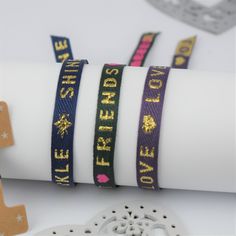 These gorgeous Cute Ribbon Text Bracelets are the perfect gift for BFFs! Buy one and get another for free--it's like a two-for-one deal with double the cuteness! Each set comes mounted on a card and presented in an organza gift pouch, so you can split them up for layering or gift them to your bestie! Now there is no excuse not to have some fun with fashion! Set of two cute Ribbon Text Bracelets that are easy to adjust and one size fits all. The perfect gift for friends to share or keep both to wear and layer. Our cheerful series of ribbon text bracelets are a real must have! Your set of two bracelets are presented on a high quality star print card and sent to you in an organza gift pouch. Choose your favourite text and we'll make sure that bracelet is on the card with one other bracelet fr Trendy Adjustable Wrap Bracelet For Party, Trendy Adjustable Friendship Bracelets For Party, Trendy Adjustable Name Bangle Bracelet, Trendy Adjustable Bangle Name Bracelet, Adjustable Band Bracelet For Party, Trendy Wrap Bangle Bracelet For Friendship, Adjustable Friendship Bracelets Gift, Adjustable Band Friendship Bracelets As Gifts, Trendy Adjustable Friendship Bracelets As Gifts