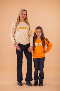 EACH TOP SOLD SEPARATELY!*Please refer to size chart for the best fit* Long sleeve design makes it a perfect pick all Fall Mom top reads "Pumpkin" & child top reads "Spice" Ultra-soft material for comfort & ease These "Pumpkin & Spice" Chenille Patch Tops features long sleeves and a fun saying on the front. In a versatile color, this top is made from soft and breathable fabric that will keep her comfy during all adventures. She can pair it with a variety of SIP bottoms & our booties for the perfect look! Little ones love to match their mommy! bullets:Includes: Top only 95% Polyester, 5% Spandex Cute Fall T-shirt For Playtime, Cute Long Sleeve Orange Top, Fall Playtime Crew Neck Tops, Long Sleeve Tops For Fall Playtime, Cute Orange Tops For Fall, Cute Orange Top For Fall, Cute Orange Fall Tops, Cute Orange Fall Top, Fall Family Matching Crew Neck Tops