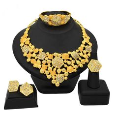 Indulge in luxury with this exquisite Necklace Set, perfect for wedding parties. With its opulent design and superior craftsmanship, this set features a necklace, bracelet, earrings, and ring. Make a lasting impression and elevate your style with this luxurious jewelry set.” Dubai Gold Jewelry Set, Nigeria Fashion, African Wedding Jewelry, Dubai Gold Jewelry, Gold Jewelry Set, Luxurious Jewelry, Bridal Accessories Jewelry, Crystal Clutch, Gold Jewelry Sets