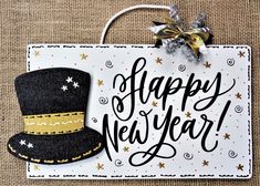 a happy new year sign with a top hat