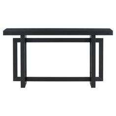 a black table sitting on top of a white floor next to a wooden shelf with two legs