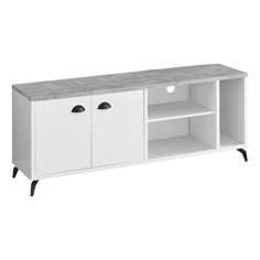 a white tv stand with two doors and shelves on one side, an open shelf to the other