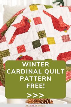 a quilted bird sitting on top of a table next to a pine cone with the words winter cardinal quilt pattern free