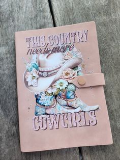 a pink book with cowboy boots and flowers on the cover that says, this country needs some cowgirls