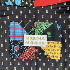 there is a patchwork design on the back of a jacket that says martha moore