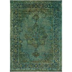 an antique rug with blue and green colors