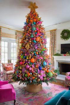 a brightly colored christmas tree in a living room