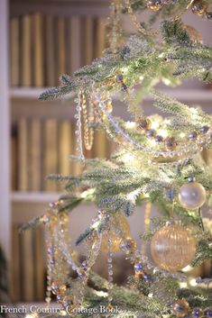 a white christmas tree with ornaments on it