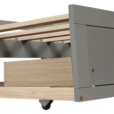 a close up of a wooden shelf on wheels