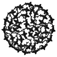 a circular metal object with many small black birds on it