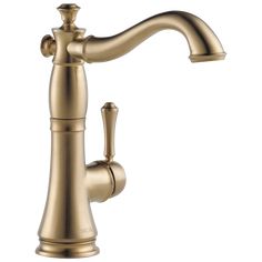 a gold faucet on a white background