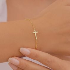 Description Sideways Cross Bracelet, Gold Cross Bracelet, Silver Cross Bracelet, Dainty Cross Bracelet ♥ Handmade with love ♥ Free Gift Box and Gift Messages MATERIALS & QUALITY 100% High Quality Necklaces 100% Made on Fine 925 Sterling Silver Chain  14k Gold Plated, Sterling Silver or Rose Gold Plated jewellery. EASY TO ORDER ♥ Please select your preferred chain length and colour from the menu. ♥ Please select your preferred style from the menu. PACKAGING & GIFTS We will package your order in a Affordable Elegant Cross Bracelet, Infinity Necklace With Names, Jesus Jewelry, Gold Cross Bracelet, Silver Cross Bracelet, Cross Charm Necklace, Christian Bracelets, Gold Plated Jewellery, Bracelet Dainty