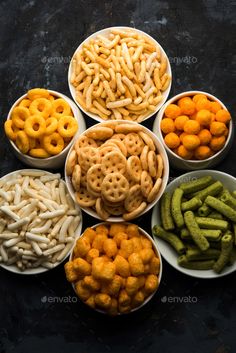 six bowls filled with different types of snacks on top of each other - stock photo - images