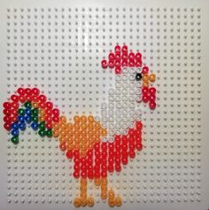 a colorful chicken made out of plastic beads