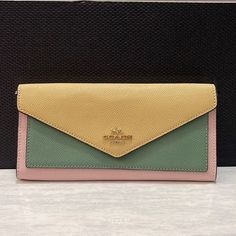 Nwt Coach Slim Envelope Wallet With Chain In Colorblock Product Details Details: Crossgrain Leather Eight Credit Card Slots Full-Length Bill Compartment Snap Closure Outside Zip Coin Pocket Detachable Chain Strap With 23" Drop For Shoulder Or Crossbody Wear 7 3/4" (L) X 3 1/2" (H) X 3/4" (W) Elegant Multicolor Clutch Wallet, Elegant Yellow Wallet, Gold Rectangular Coach Wallet On Chain, Elegant Multicolor Wallet For Daily Use, Elegant Multicolor Wallets With Card Slots, Elegant Multicolor Wallets For Everyday Use, Elegant Multicolor Wallets For Daily Use, Elegant Multicolor Travel Wallets, Elegant Yellow Wallet With Card Slots