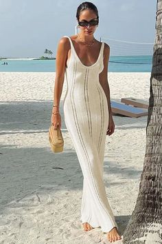 Discover effortless elegance with this White Knit Hollow Out Long Dress for women. Perfect for beach holidays or parties, this slim fit dress features a V-neck design, ruffled hem, and a backless style. Made with high-quality knitwear material, it offers comfort and style in one stunning piece. Elegant Stretch Crochet Dress For Beach, Fitted V-neck Vacation Dress, Fitted V-neck Crochet Summer Dress, Elegant V-neck Crochet Dress For Summer, Elegant Bodycon Maxi Dress For Beach, Elegant Bodycon Beach Maxi Dress, Chic Stretch Beach Dress For Vacation, Elegant Fitted Crochet Beach Dress, Casual Fitted Backless Beach Dress