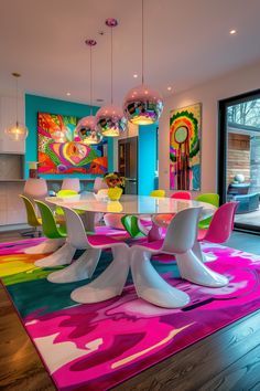 a dining room with colorful rugs and art on the walls