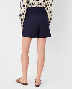 Elevate your wardrobe with the Ann Taylor Sailor Shorts, a blend of sophistication and comfort tailored to perfection. These high-rise shorts in a stunning Night Sky color are designed to flatter with a tailored and fitted silhouette that hits at mid-thigh, ensuring a versatile wear for any occasion.

- **Size**: 12 (Regular)
- **Color**: Night Sky
- **Material**: 78% Cotton, 20% Rayon, 2% Spandex
- **Fit**: Tailored & Fitted
- **Rise**: High rise; sits 1/2" to 1" below natural waist
- **Length* Navy Shorts For Spring With Short Inseam, Navy High-waisted Shorts For Spring, Navy Shorts With Short Inseam For Spring, Navy Spring Shorts With Short Inseam, Classic Short Bottoms With Built-in Shorts, High Waist Compressive Shorts With Built-in Liner, Navy Workwear Shorts, Classic Bottoms With Built-in Shorts And 5-inch Inseam, High-waist Cotton Shorts With Rolled Hem