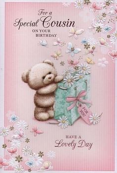 a greeting card with a teddy bear holding a present