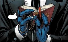 a person with blue hands holding a book in front of their face while wearing a black suit