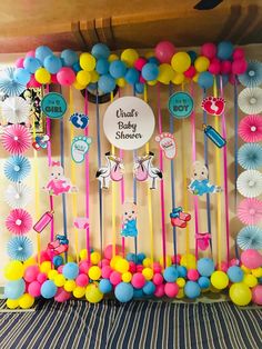 a baby shower decoration with balloons and streamers