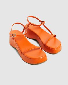 The Lola Flatform Sandals by Alice In The Eve are a tangerine orange colourway. The sandals feature thin straps and a buckle clasp. The shoes have a platform base. Pair back with a denim maxi skirt and crop for the ultimate summer vibe. Orange Things, Orange Sandals, Orange Wedges, Pretty Orange, Teen Shopping, Destination Dress, Orange Shoes, Denim Maxi, Flatform Sandals