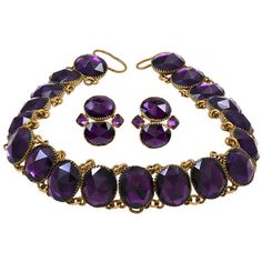 Amazing "Queen Anne" amethyst paste necklace set in gilt metal. Please Note: The earrings are not included. This style of jewelry was misnamed for Queen Anne, who reigned from 1695 to 1714, as the necklace was made in the mid 18th century. The necklace is comprised of non-graduated rivieres. The vivid purple paste stones used are faceted as rose cuts and collet-set. The necklace fastens with a ribbon. The paste stones run 10.5 inches while the ribbon makes up the rest of the length of the neckla 18th Century Jewelry, Paste Jewelry, Riviere Necklace, Vintage Choker Necklace, Georgian Jewelry, Mesh Necklace, Ribbon Jewelry, Jewelry Styles, Vintage Choker