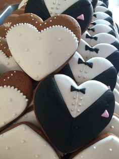 decorated cookies are arranged in the shape of hearts