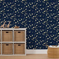 a blue wallpaper with yellow splats on it and wicker baskets in the foreground