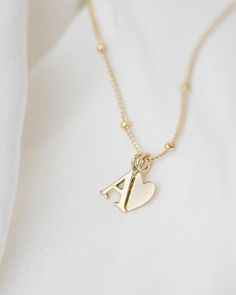 "Personalized 14k solid gold initials necklace with beautiful beaded chain.  Simple, minimalist everyday necklace. Perfect wearing alone or layering with your favorite necklaces. Each initial measures approx. 7mm,  You can add up to 5 Initials (Heart counts as ONE initial ) Chain Length: 18\" Available in 14K Yellow Gold    * Leave us your initials and placement in the comment box at checkout." Tiny Diamond Necklace, Gold Initial Necklace, Jewelry Accessories Ideas, Initial Necklace Gold, Initial Jewelry, Everyday Necklace, Gold Initial, Bead Chain