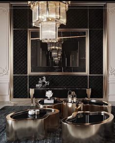 an elegant bathroom with black and gold decor, chandelier and round bathtub