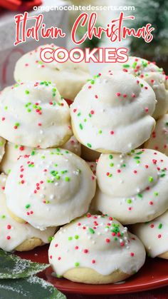 italian christmas cookies with sprinkles on a red plate and holly leaves in the background