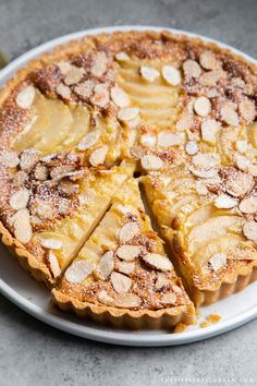 there is a pie on the plate with slices cut out and ready to be eaten