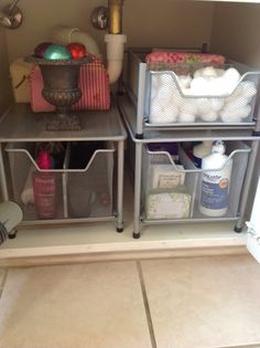 the shelves are organized with baskets and toiletries