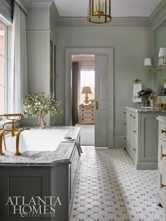 a large bathroom with two sinks and a bathtub in the middle of the room