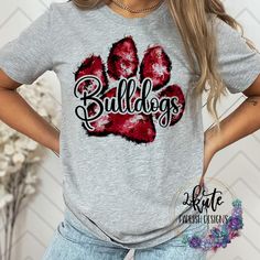 Pick yourself up one of these fun and spirit-filled Bulldogs shirts. This shirt is sure to impress your friends and show your true bulldog spirit. These super cute tees make great team sports shirts or great mom shirts for your athlete.  It's a soft shirt that is unisex sizing. The shirt is made of 95% polyester and 5% spandex but soft like cotton To get the best wear from your shirt make sure to  1. Wash in cold water 2. Tumble dry low 3. Do not iron on design area 4. Do not use fabric softener Bulldogs Football Shirts, Bulldogs Cheer, Cheer School, Iron Ideas, Bulldog Tshirt, Cute Tees, Great Mom, Bulldogs Football, School Spirit Shirts