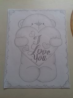 a drawing of a teddy bear with the words i love you on it's chest